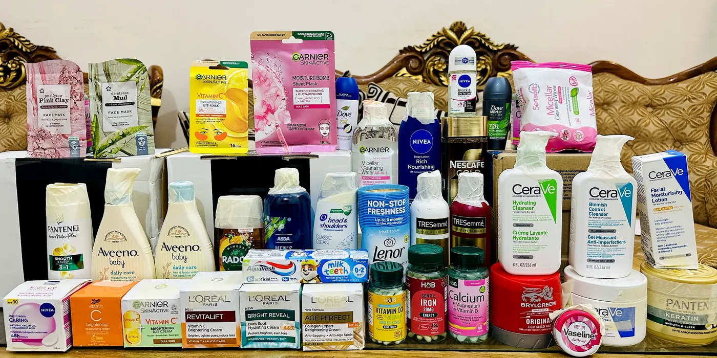 UK products on one table, photographed by us: CeraVe, Garnier, L'Oréal, Nivea, Aveeno, Pantene, TRESemmé, H&B vitamins and more